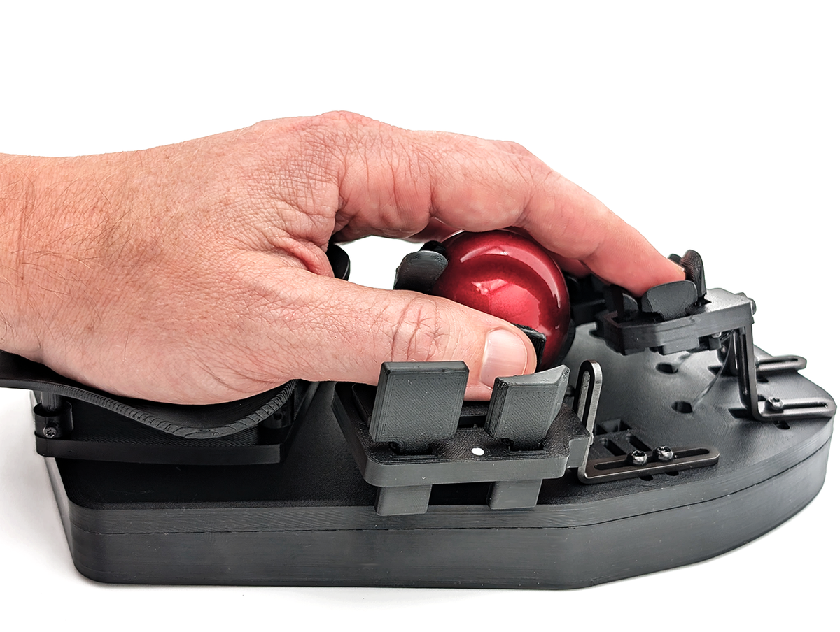 A hand on a Svalboard Lightly half, fingers on the key clusters